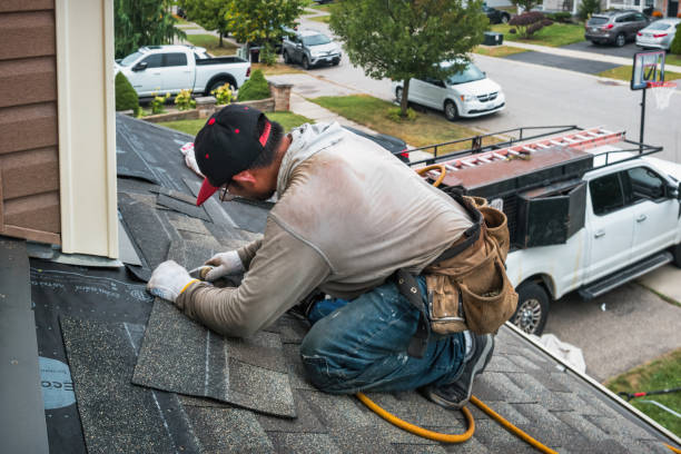 Professional Roof Replacement technician working in Medford, MA